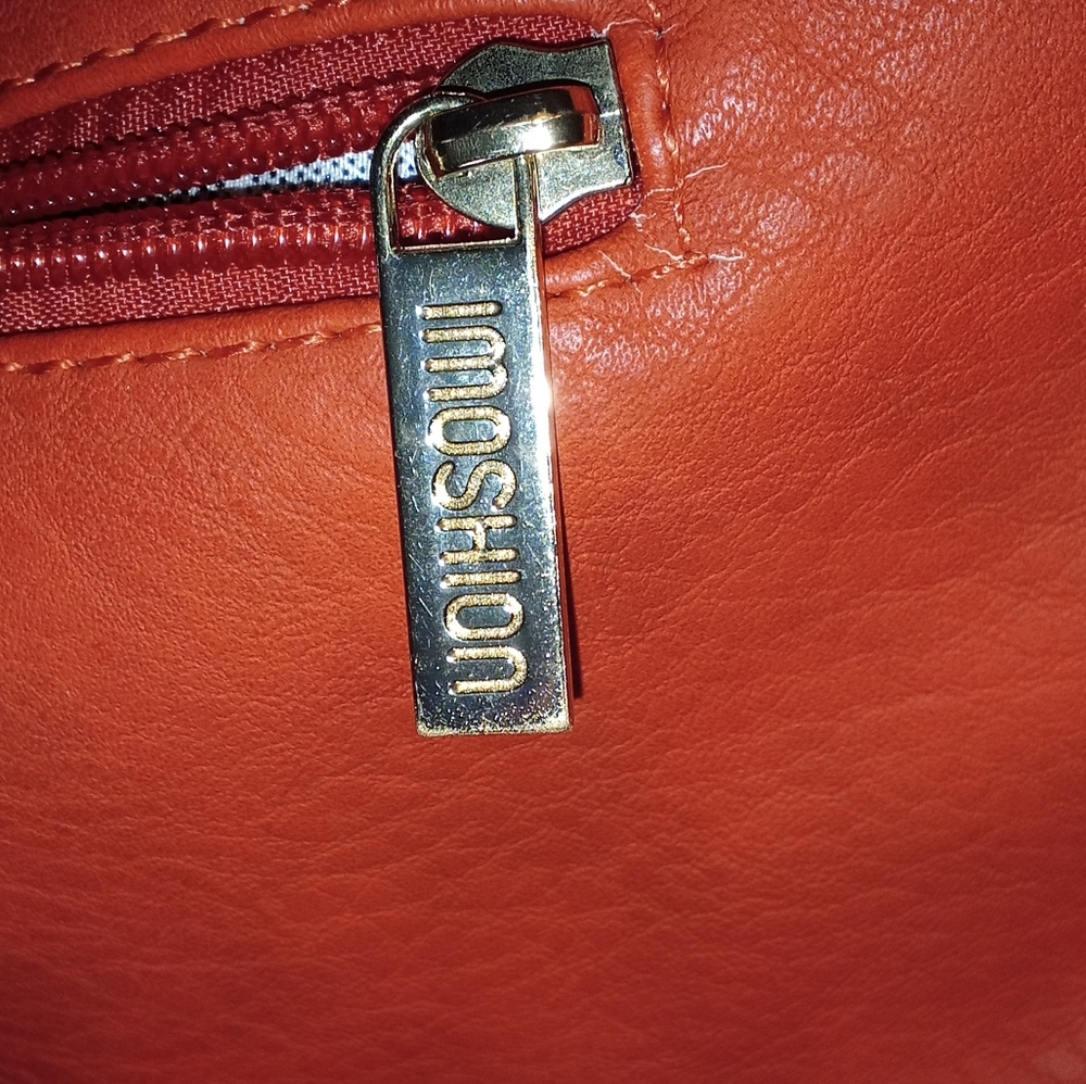 Red leather shoulder bag.